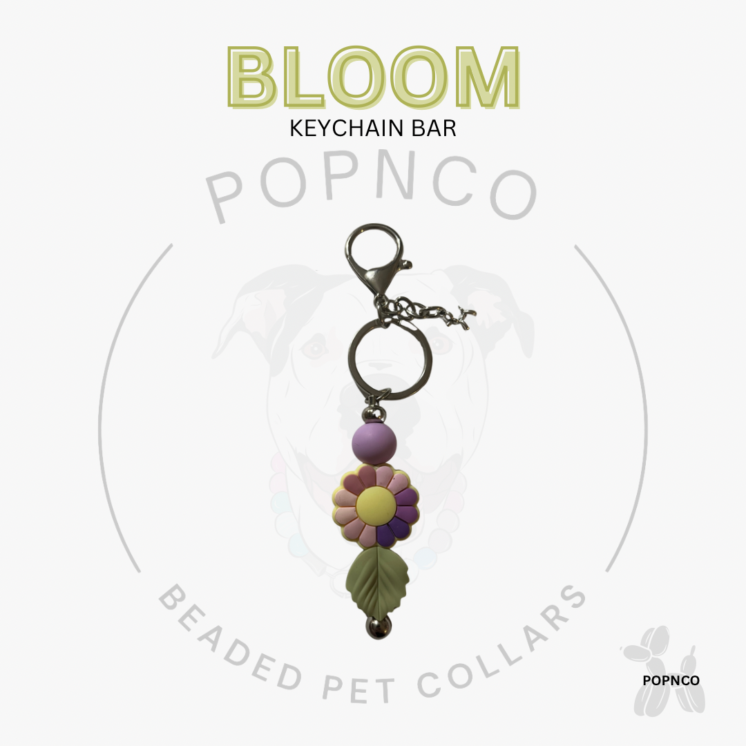 Keychain bar with floral design on a white background, featuring the brand 'Popnco'.