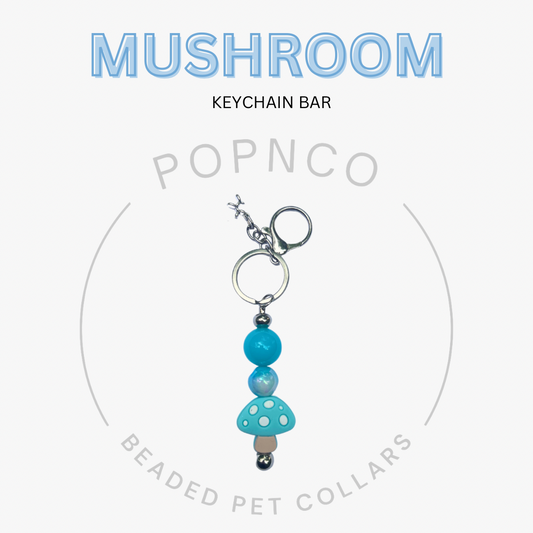 Turquoise mushroom keychain bar with 'Popnco' branding on a white background