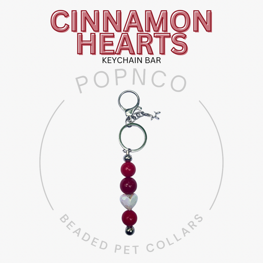 Cinnamon Hearts keychain bar with beads on a white background, featuring the brand 'Popnco'.