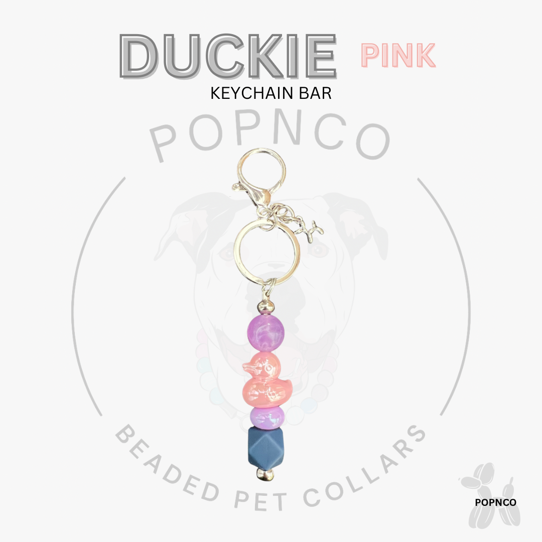Pink beaded keychain bar with 'Duckie' text on a white background