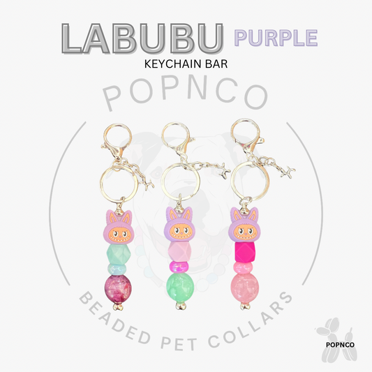 Three colorful beaded keychain bars with cartoon characters on a white background, featuring the brand 'LABUBU' and 'POPNCO'.