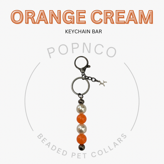 Keychain bar with orange, cream, and pearl beads on a white background with 'Orange Cream' text.