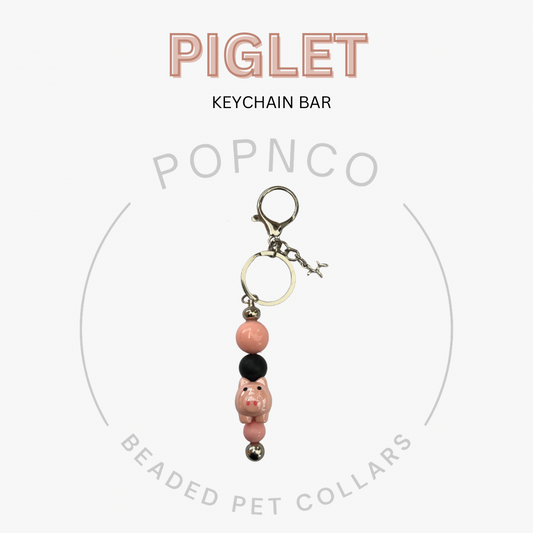 Keychain bar with piglet design on a white background, featuring the brand 'Popnco'.