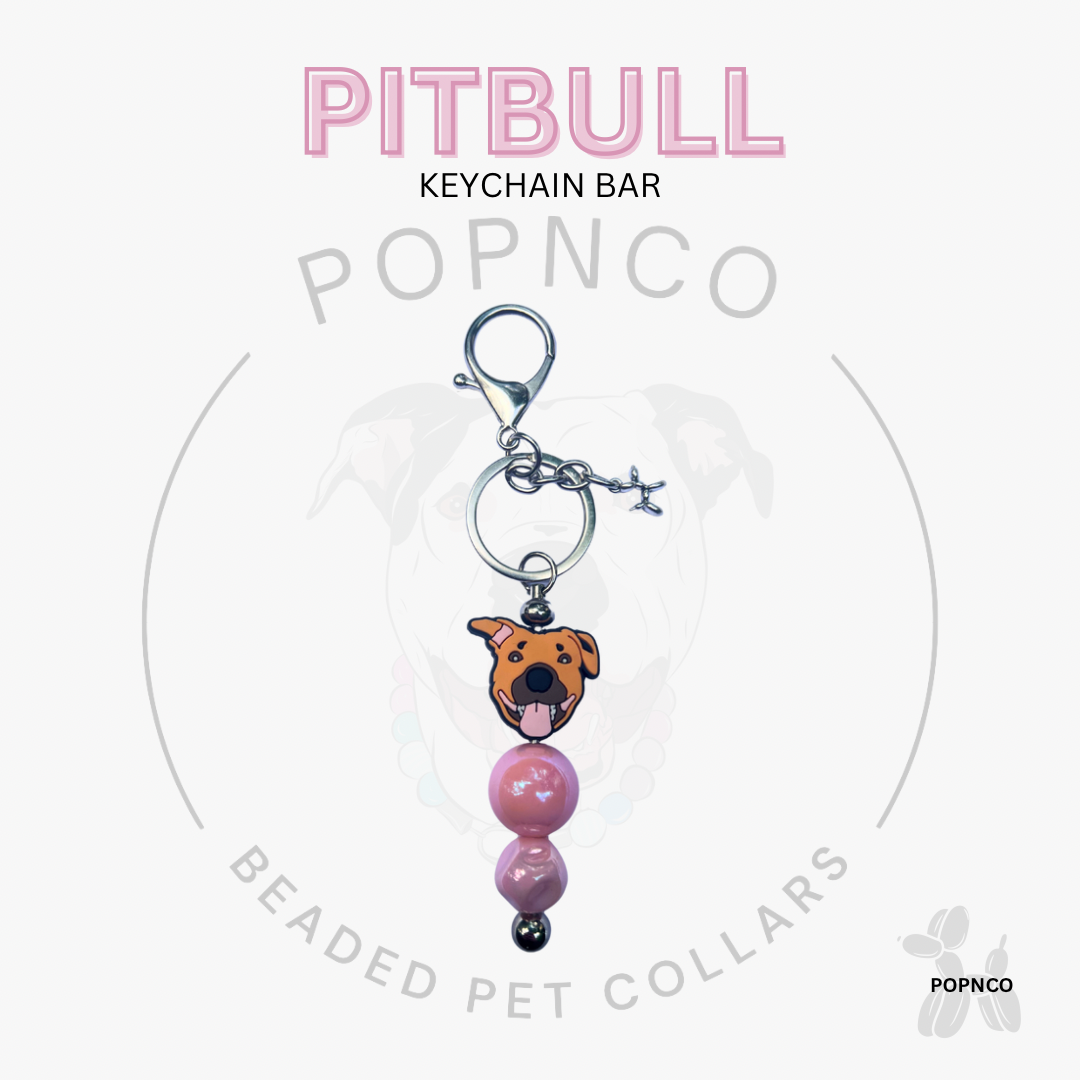 Pitbull keychain bar with pink beads on a white background, featuring the brand 'POPNCO'.