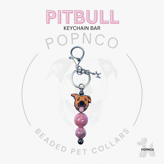 Pitbull keychain bar with pink beads on a white background, featuring the brand 'POPNCO'.