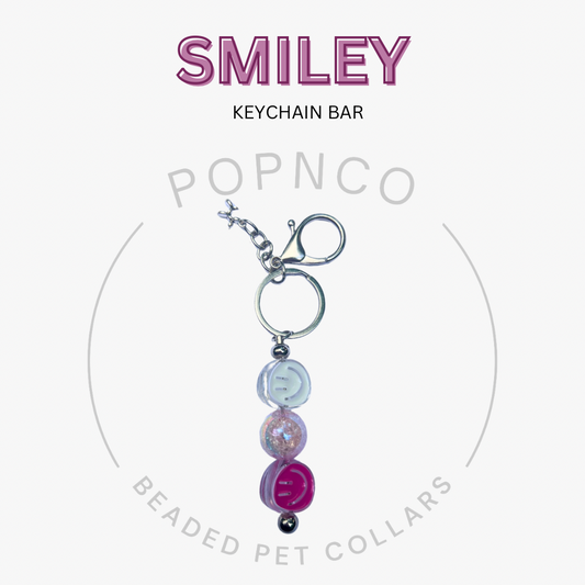 Keychain bar with colorful beads on a white background, featuring the brand 'Popnco'.