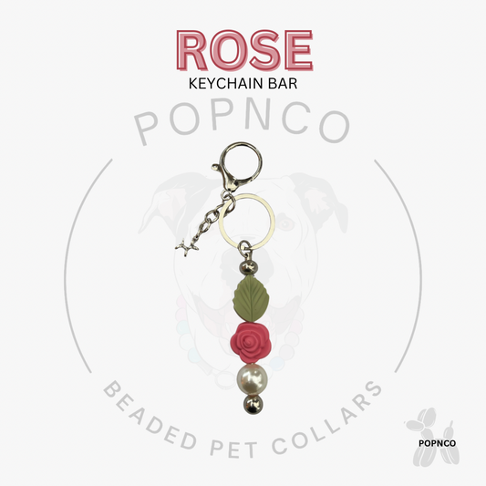 Rose keychain bar with beads on a white background, featuring the brand 'POPNCO'.