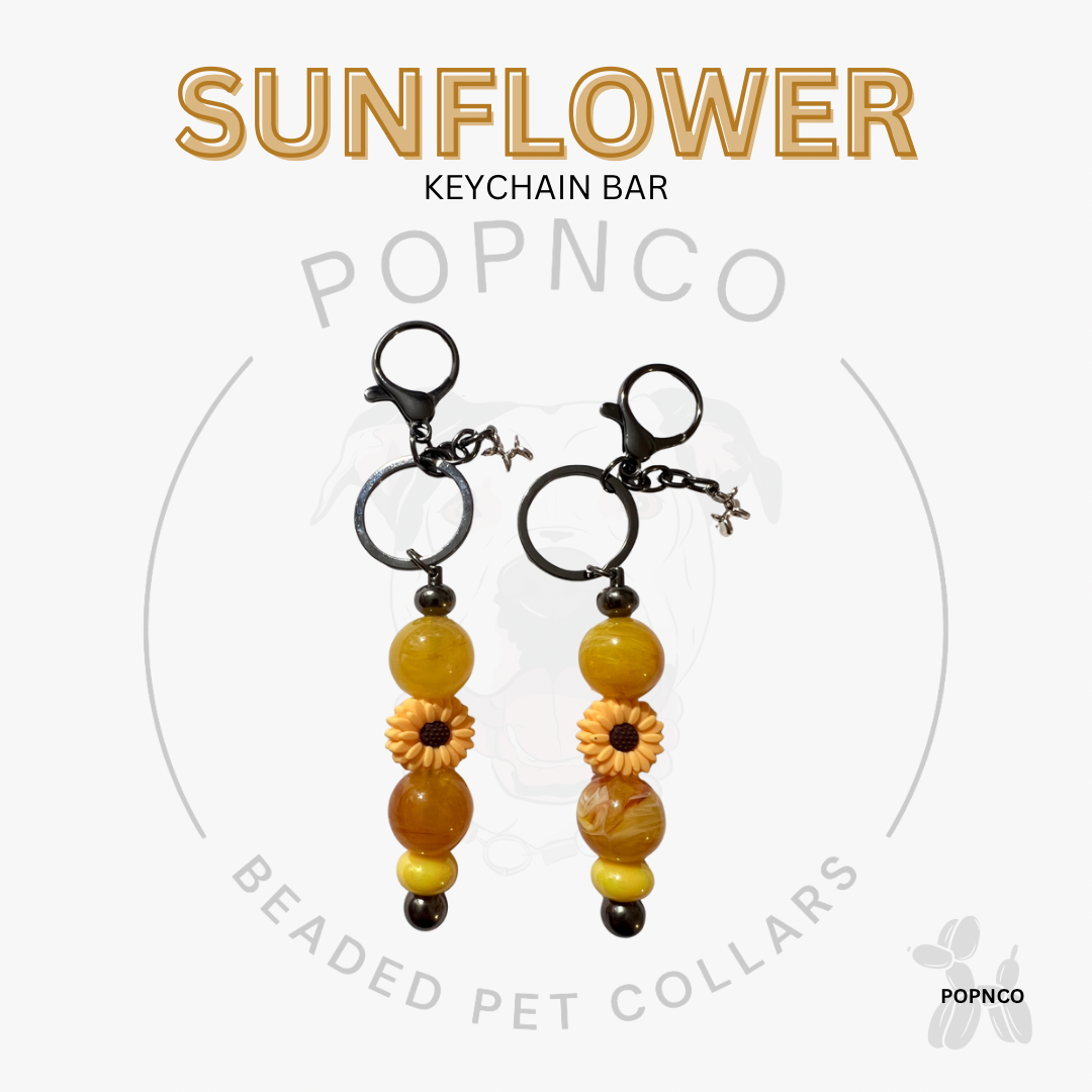Sunflower keychain bar with beads on a white background, featuring the brand 'POPNCO'.