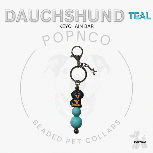 Teal beaded keychain bar with dachshund design on a white background, featuring the brand 'POPNCO'.