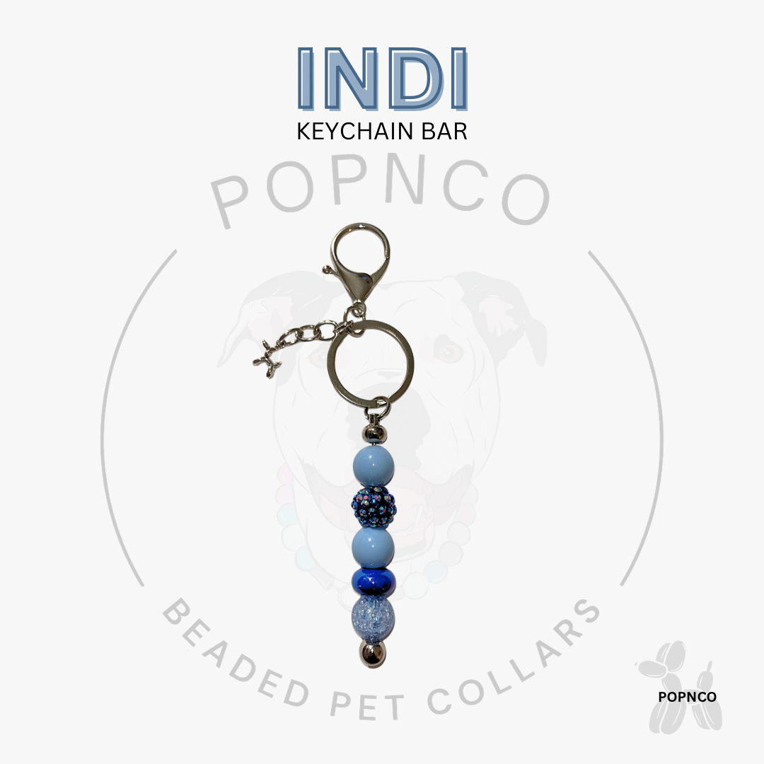 Blue Indi beaded pet collar beaded keychain bar on a white background. 