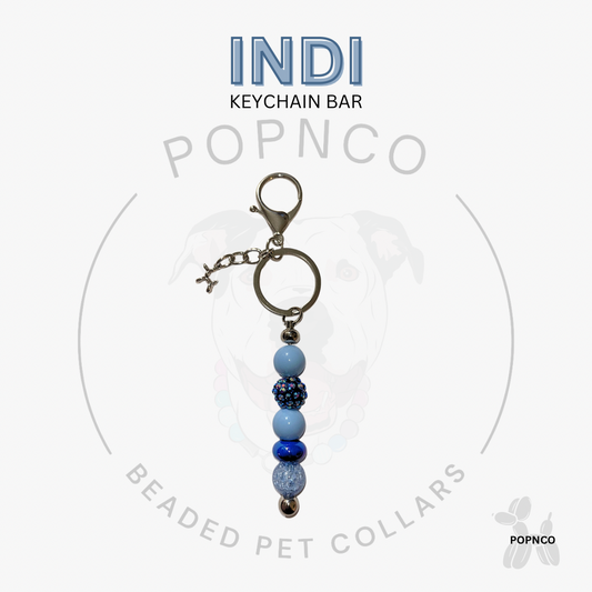 Blue Indi beaded pet collar beaded keychain bar on a white background. 