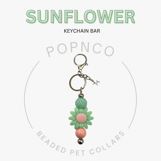 Sunflower keychain bar with beads on a white background, featuring the brand 'Popnco'.