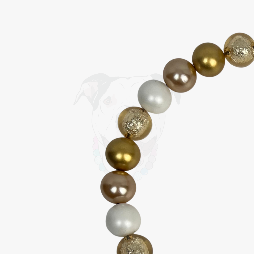 Bracelet with gold and white beads on a white background