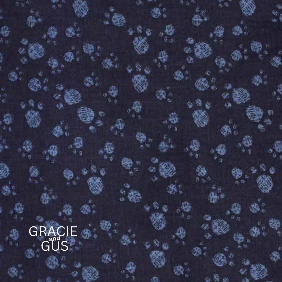 Dark navy blue fabric with a light blue hand-drawn circular floral pattern, featuring the text 'GRACIE and GÜS' in the bottom left corner.