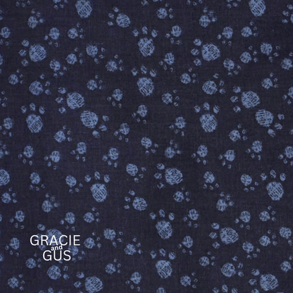 Dark navy blue fabric with a light blue hand-drawn circular floral pattern, featuring the text 'GRACIE and GÜS' in the bottom left corner.
