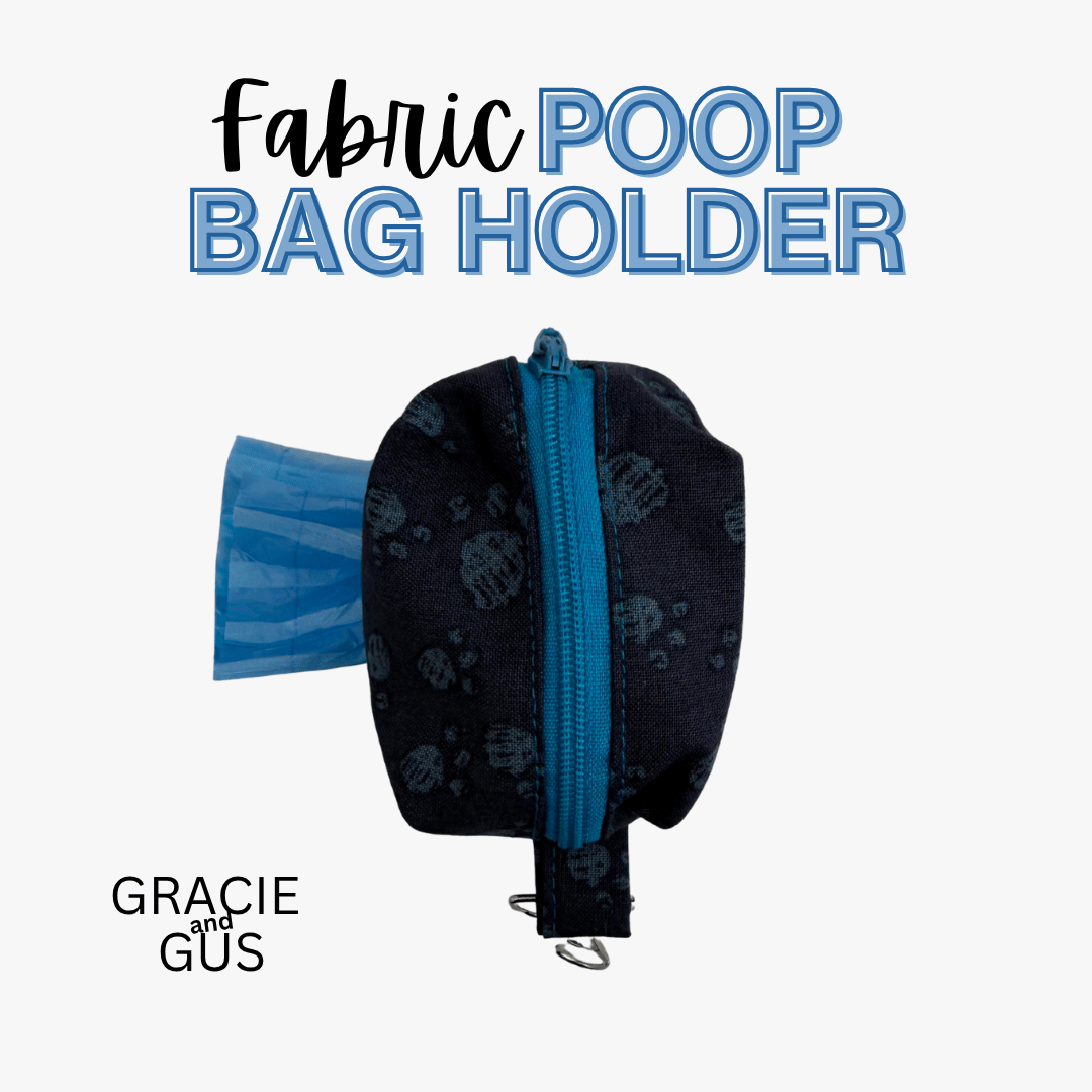 A fabric poop bag holder pouch in a very dark navy blue with a subtle paw print pattern, featuring a bright blue zipper and a blue plastic bag partially pulled out. The text 'Fabric POOP BAG HOLDER' is displayed at the top, and 'GRACIE and GUS' is shown at the bottom left, all on a clean white background.