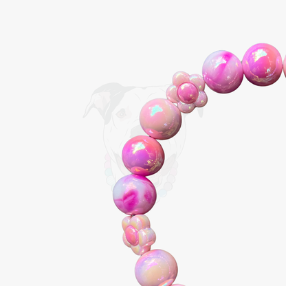 Pink and white bubblegum-shaped balloons on a white background