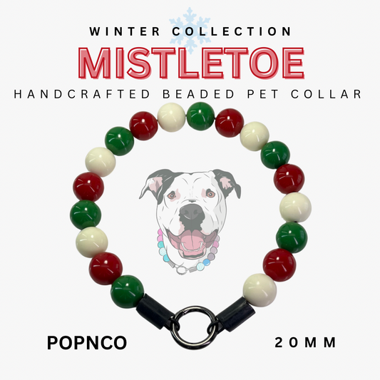 Handcrafted beaded pet collar with red, green, and white beads on a white background, featuring a dog illustration and text about the 'Mistletoe' collection.