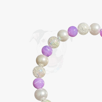 Beaded bracelet with purple and white beads on a white background POPNCO