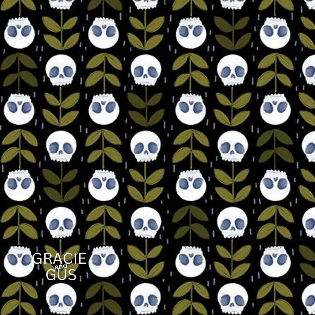 A repeating pattern of white skulls with blue eyes and olive green leaves on a black background, with the text 'GRACIE GUS' in the lower left corner.