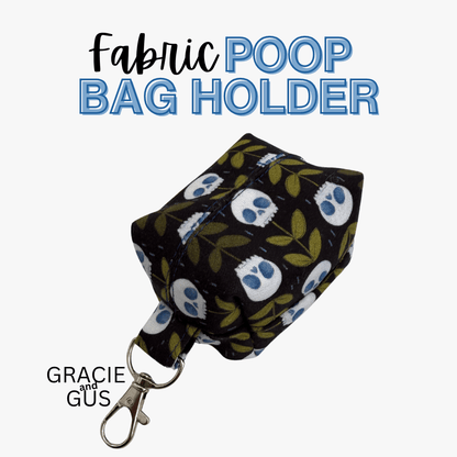 A fabric poop bag holder with a black background, white owl pattern, and green leaves, attached to a silver metal clasp. The text 'Fabric POOP BAG HOLDER' is displayed at the top, and 'GRACIE and GUS' is displayed at the bottom left on a light gray background.