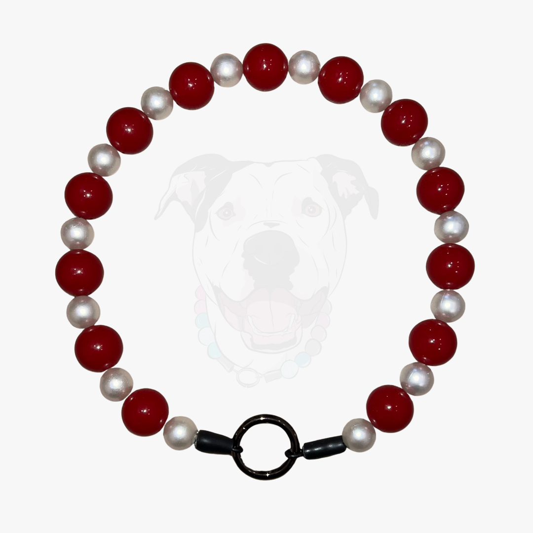 Bracelet with red and white beads on a white background