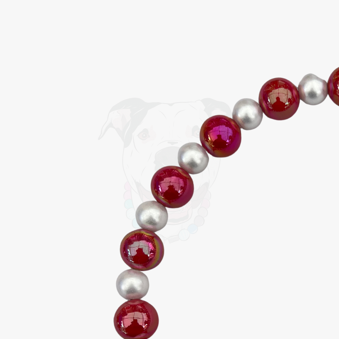 Bracelet with red and white beads on a white background