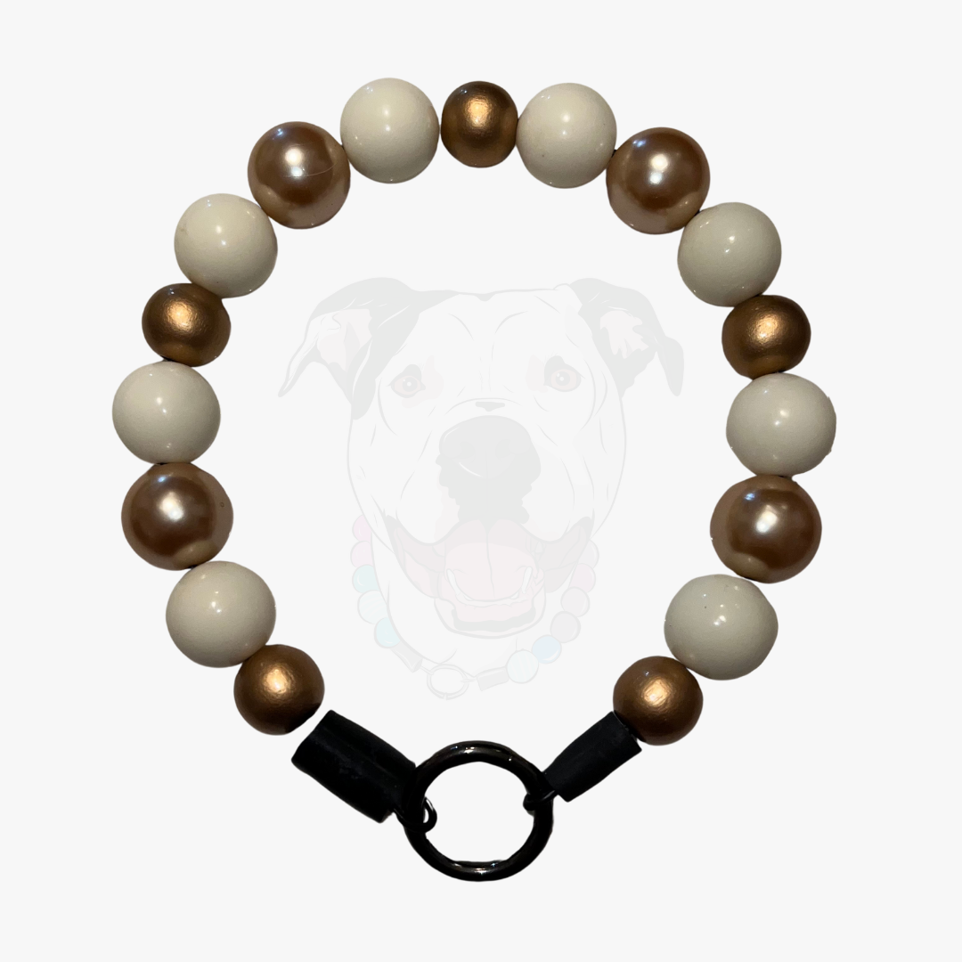 Beaded bracelet with brown and white beads on a white background