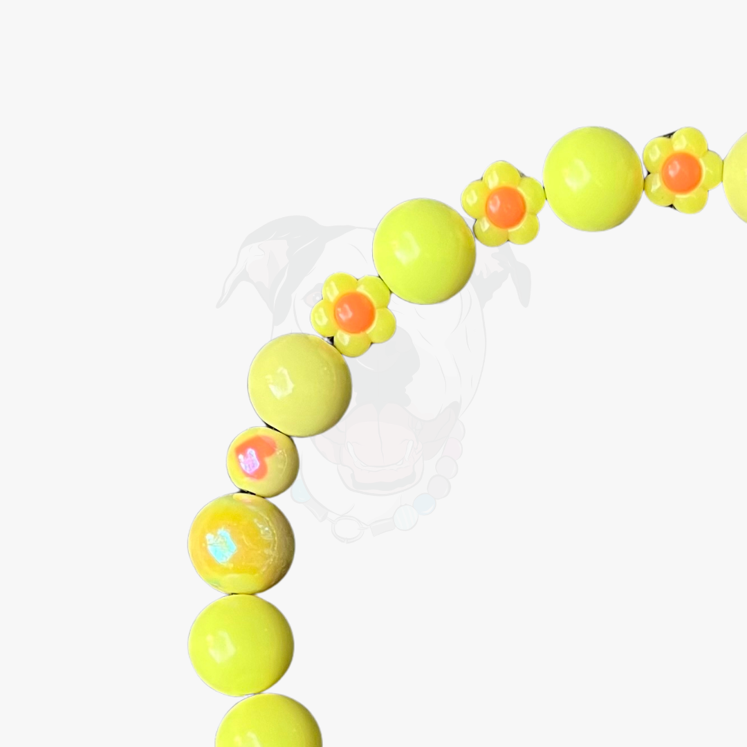 Neon yellow flower-shaped beads on a white background