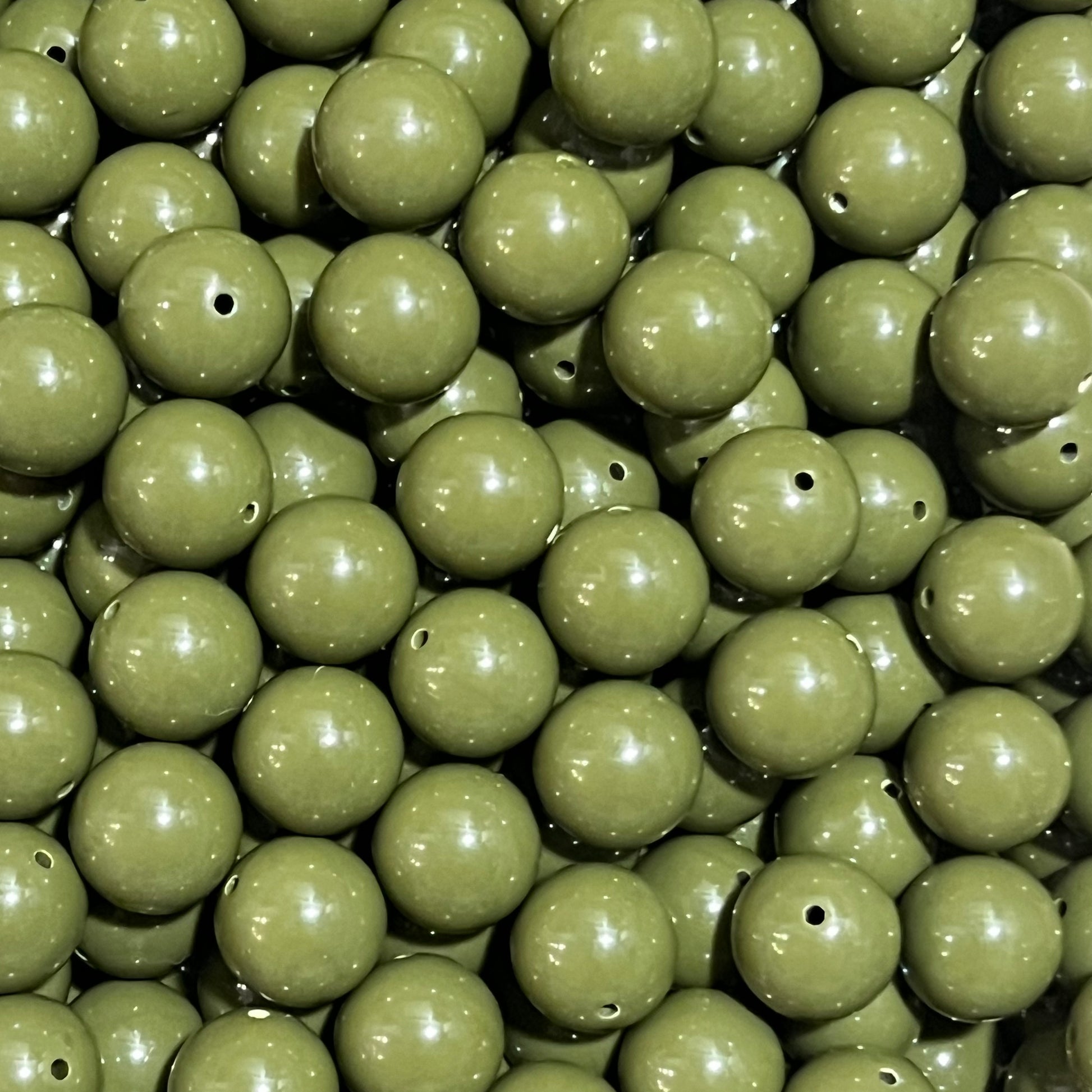 Close-up of green beads with a focus on texture and color.