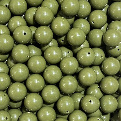 Close-up of green beads with a focus on texture and color.