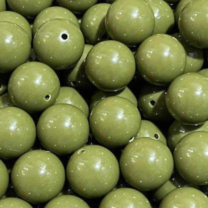 Close-up of green beads with a focus on texture and color.