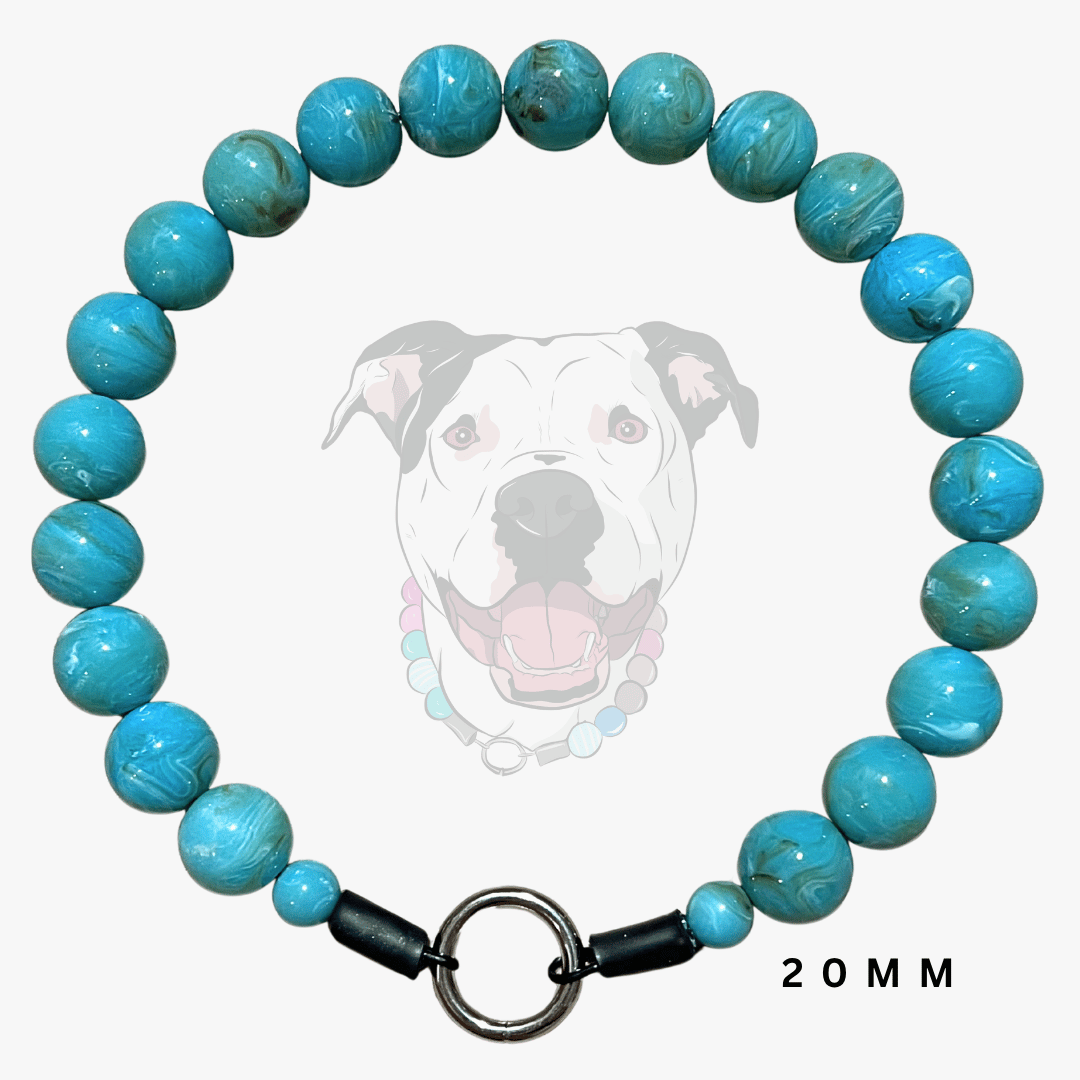 A beaded dog collar made of round turquoise-blue marbled beads with a black clasp and a metal ring, shown on a light gray background with a faint dog illustration and the text '20MM'.