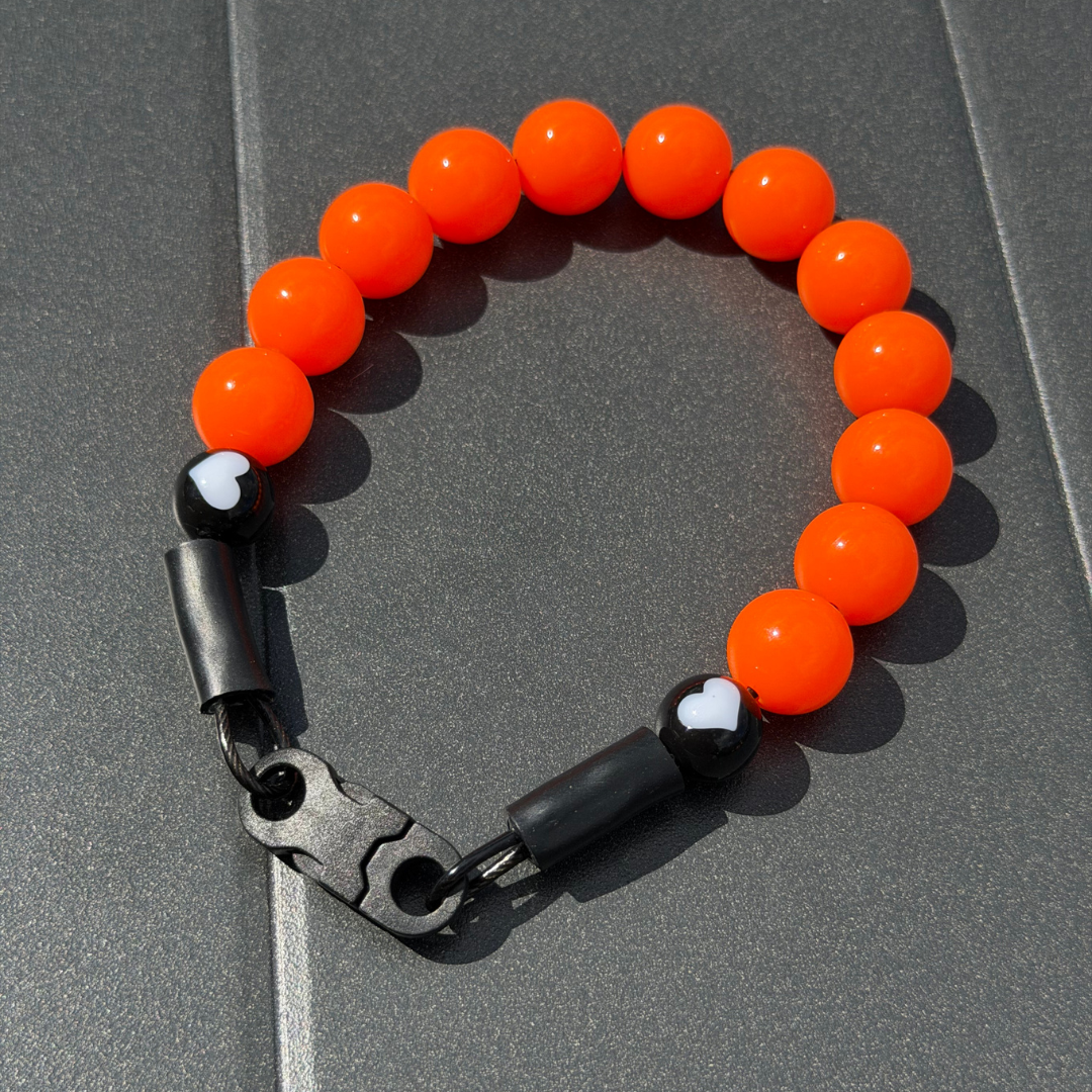 POPNCO 12mm Hunter Solid Orange beaded dog collar with a black clasp on a grey background 