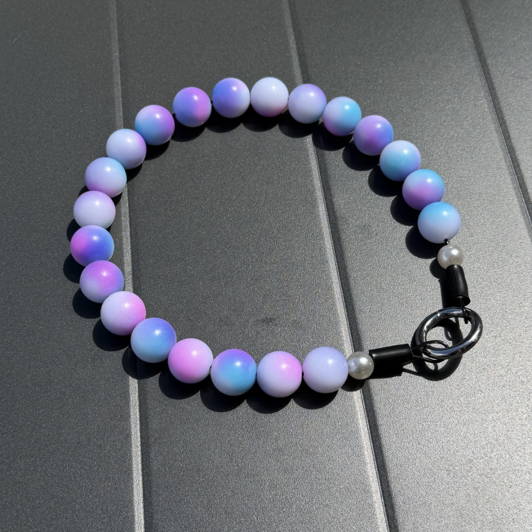 Addison handcrafted beaded dog collar with pink, purple, white and blue gradient beads on grey background | POPNCO
