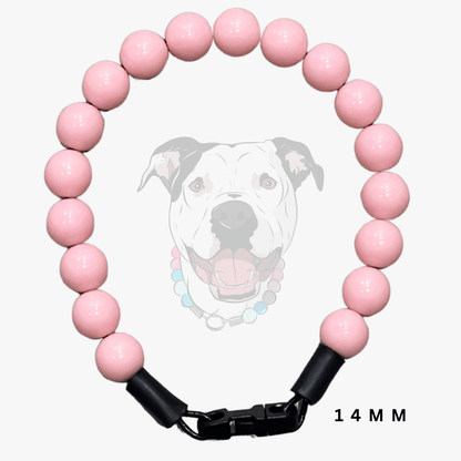A pink beaded dog collar with a black plastic clasp, shown against a light gray background with a faint dog illustration and '14 MM' text overlay.