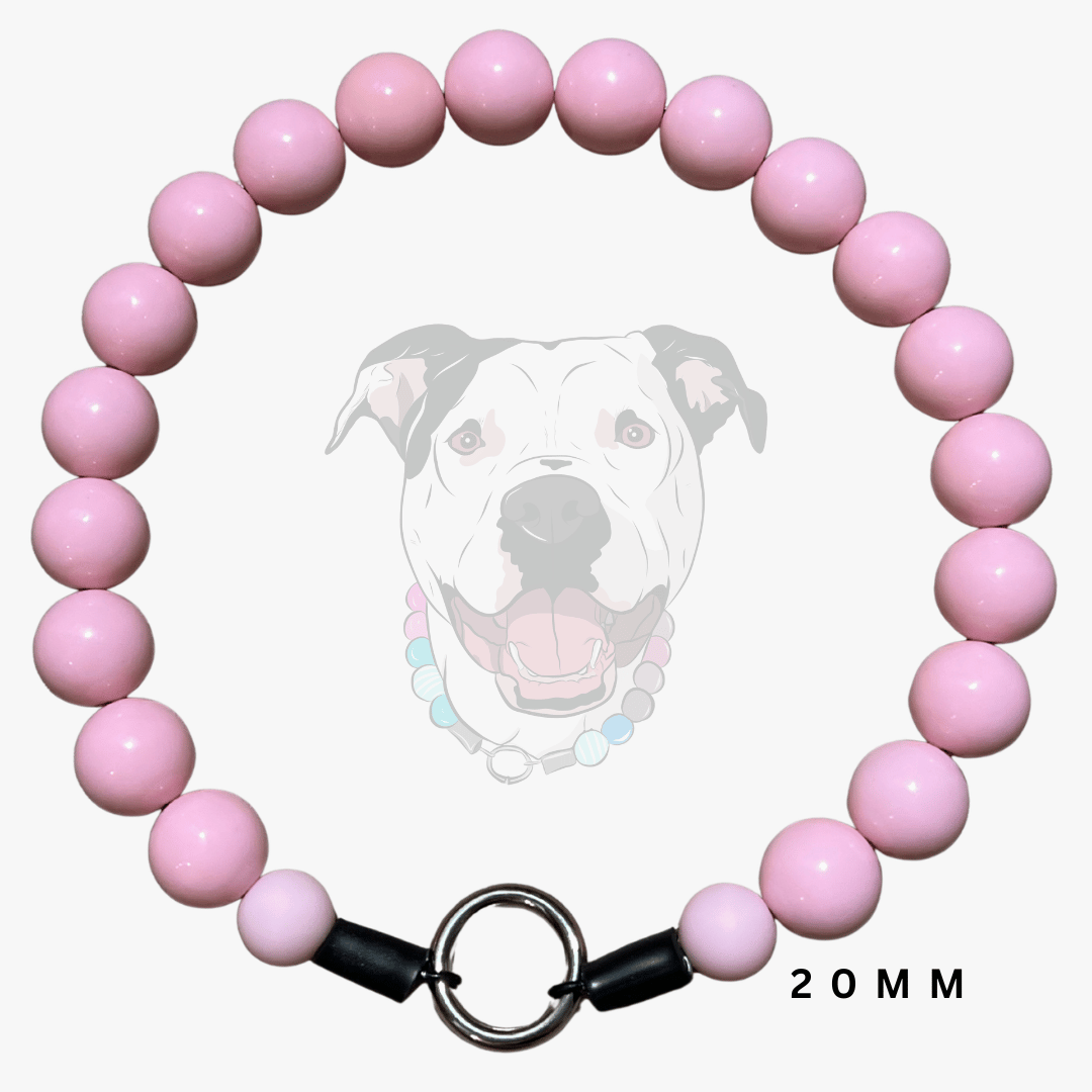 A pink beaded dog collar with a silver metal ring clasp and black end caps, displayed against a light gray background with a faint dog graphic and '20MM' text.