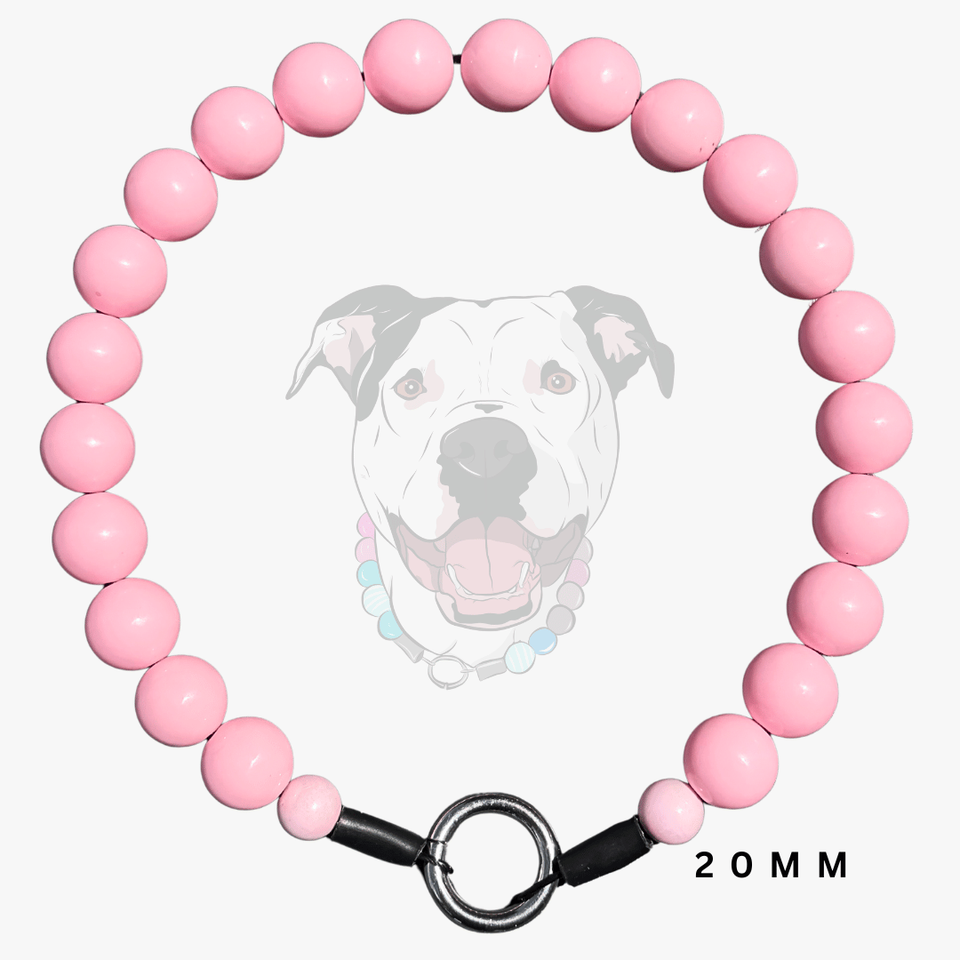 A pink beaded dog collar with a black metal ring clasp and black end caps, shown on a light gray background with a faded dog illustration and '20MM' text.