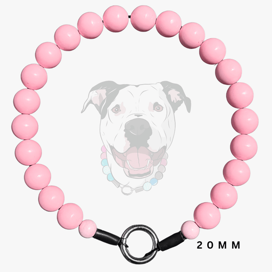 A pink beaded dog collar with a black metal ring clasp and black end caps, shown on a light gray background with a faded dog illustration and '20MM' text.