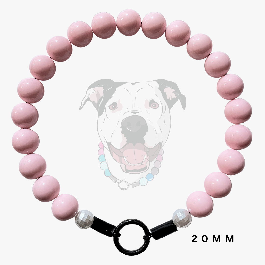 A pink beaded dog collar necklace with a black O-ring clasp and faceted clear beads, shown against a white background with a faint dog illustration and '20MM' text.
