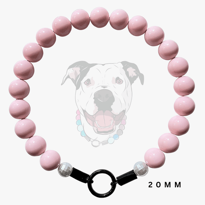 A pink beaded dog collar necklace with a black O-ring clasp and faceted clear beads, shown against a white background with a faint dog illustration and '20MM' text.