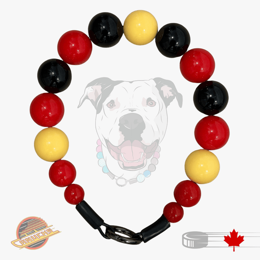 A beaded dog collar featuring glossy red, black, and yellow round beads, with a black plastic clasp. A faded graphic of a white dog wearing the collar is in the background, with a 'Pup Products' logo in the bottom-left corner and a Canadian maple leaf graphic in the bottom-right.