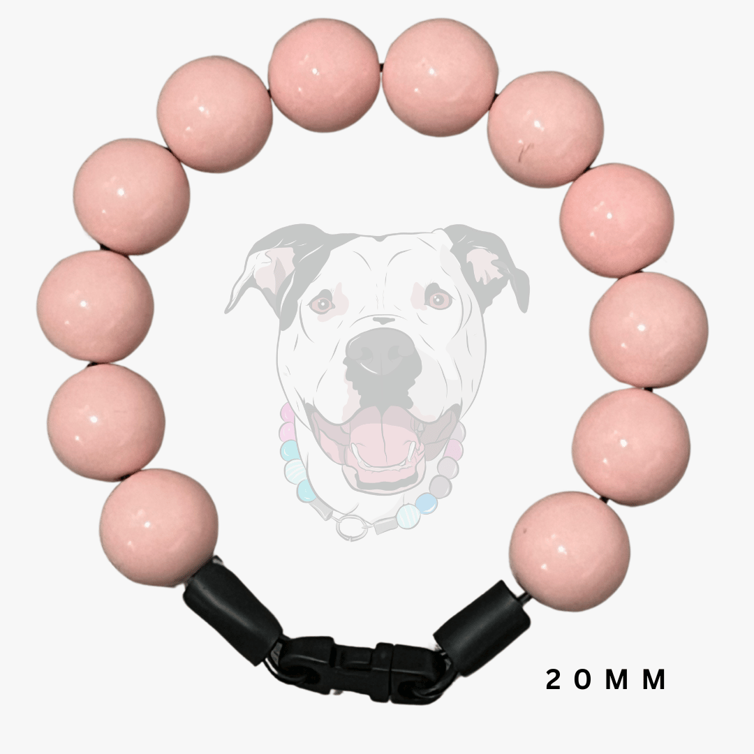 A pink beaded dog collar bracelet with a black adjustable clasp, shown against a white background with a faint dog graphic and '20MM' text.