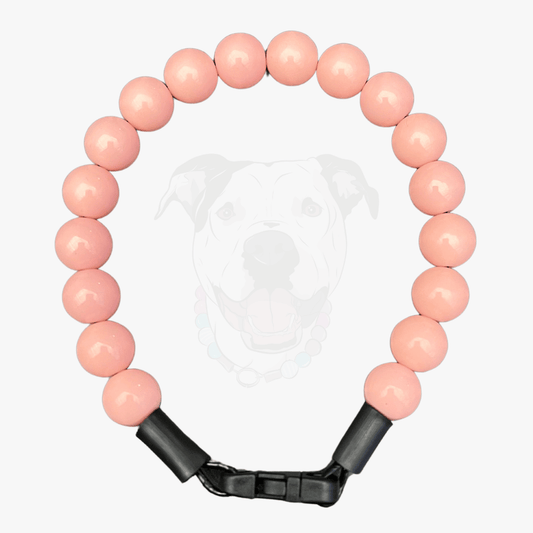 Coral pink Beaded pet collar from the classics solid collection from POPNCO, the collar is laying flat on a white background in 14mm beads. 