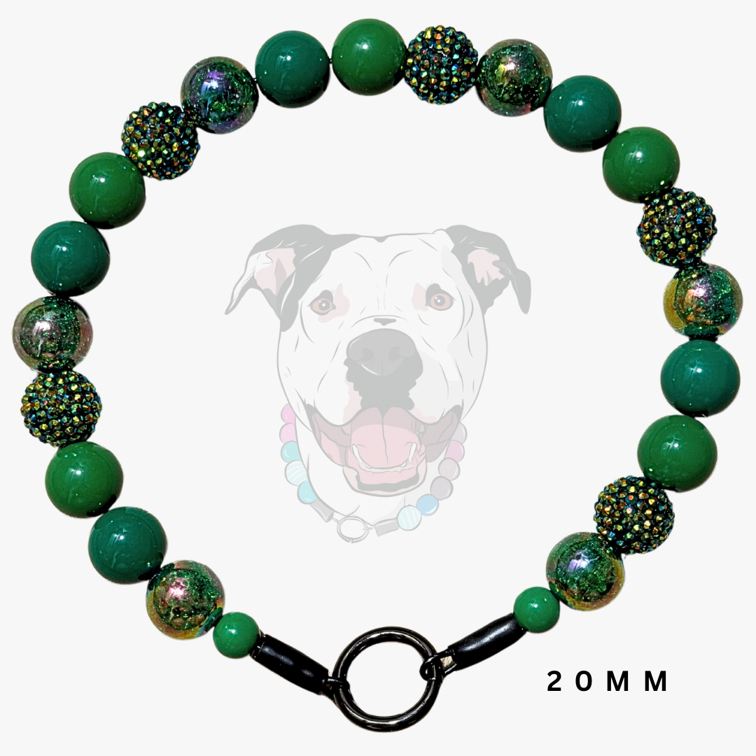 A green beaded dog collar with textured and glittery beads, featuring a black metal clasp and a faint dog graphic in the background with '20MM' text.