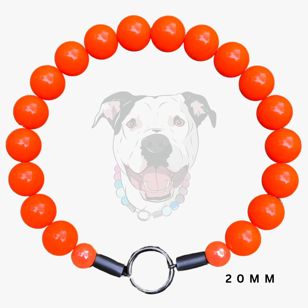 A beaded dog collar made of glossy bright orange round beads, featuring a silver metal split ring and black plastic end caps, displayed against a light gray background with a faint dog graphic and '20 MM' text.