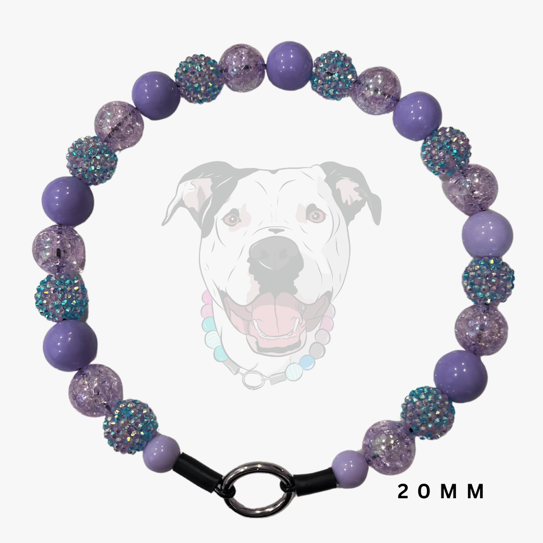 A beaded dog collar necklace featuring purple and lavender beads, some smooth and some textured with iridescent glitter, displayed on a light gray background with a faint dog graphic and '20 MM' text.