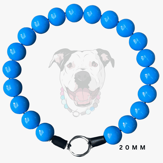 A beaded dog collar made of glossy bright blue round beads, with black end caps and a silver metal ring clasp. A faint dog face wearing the collar is shown in the background, and the text '20 MM' appears at the bottom right.