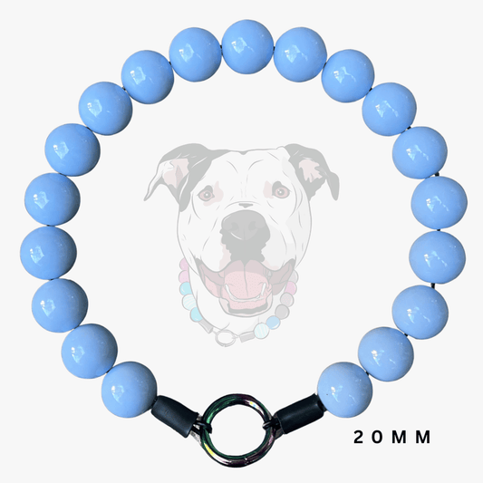 A light blue beaded dog collar with a black metal ring clasp, shown against a white background with a faint dog graphic and '20 MM' text.