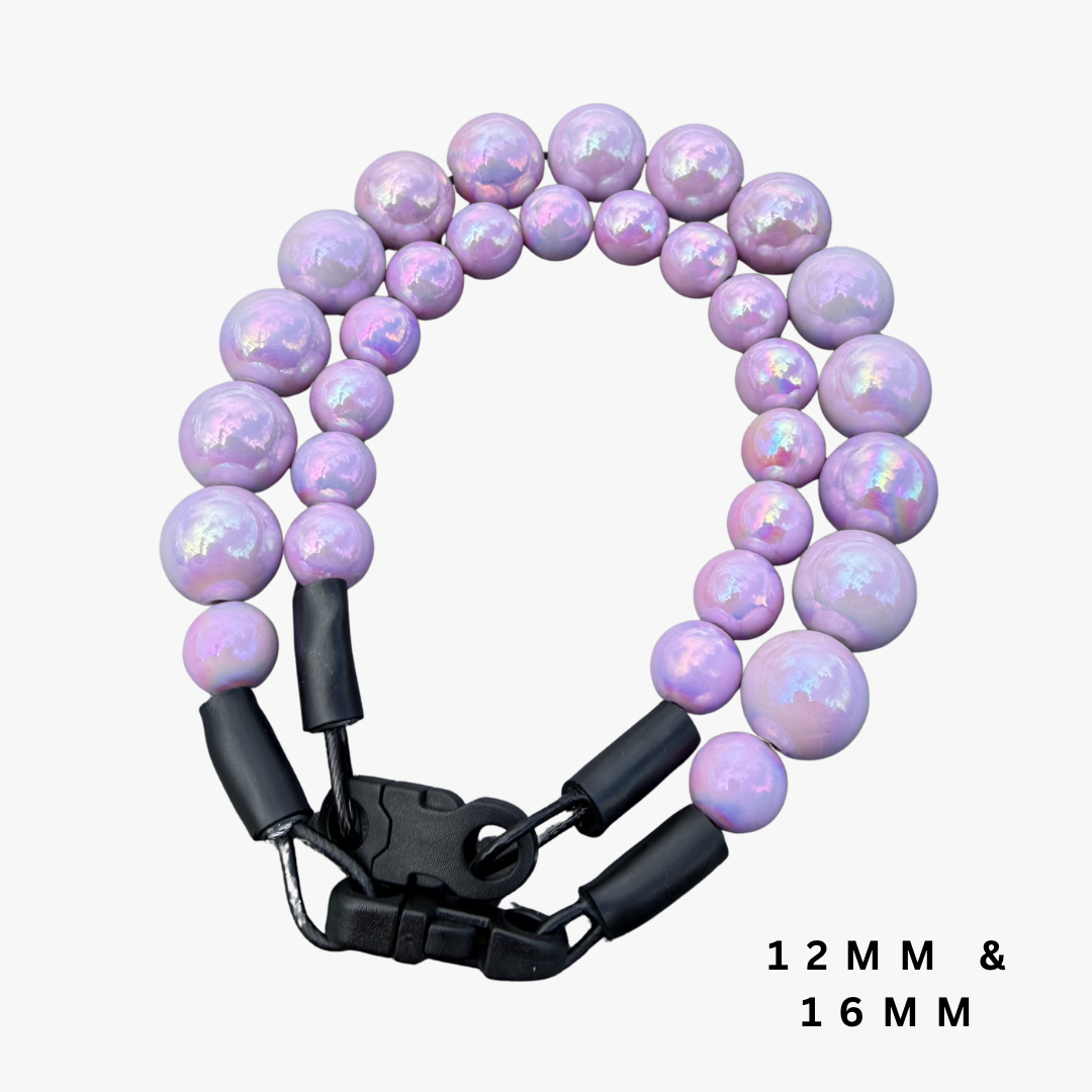 A double-strand beaded pet collar with iridescent lavender-purple beads and a black metal clasp, shown on a light gray background with text reading '12MM & 16MM'.